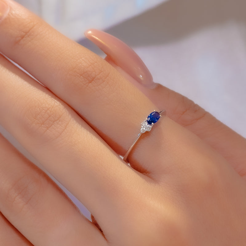 COLOURED OVAL DIAMOND RING