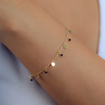 DROPPED OF CIRCLES & BEADS GOLD BRACELET