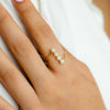 WRAPPED LINE OF PEARL GOLD RING