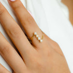 WRAPPED LINE OF PEARL GOLD RING