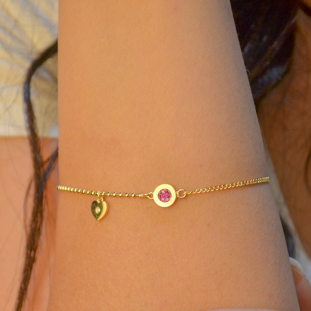 RED STONED CIRCLE WITH DROPPING HEART GOLD BRACELET